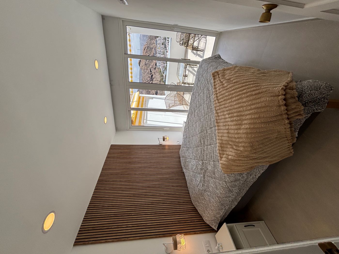Bedroom with a double bed and terrace access