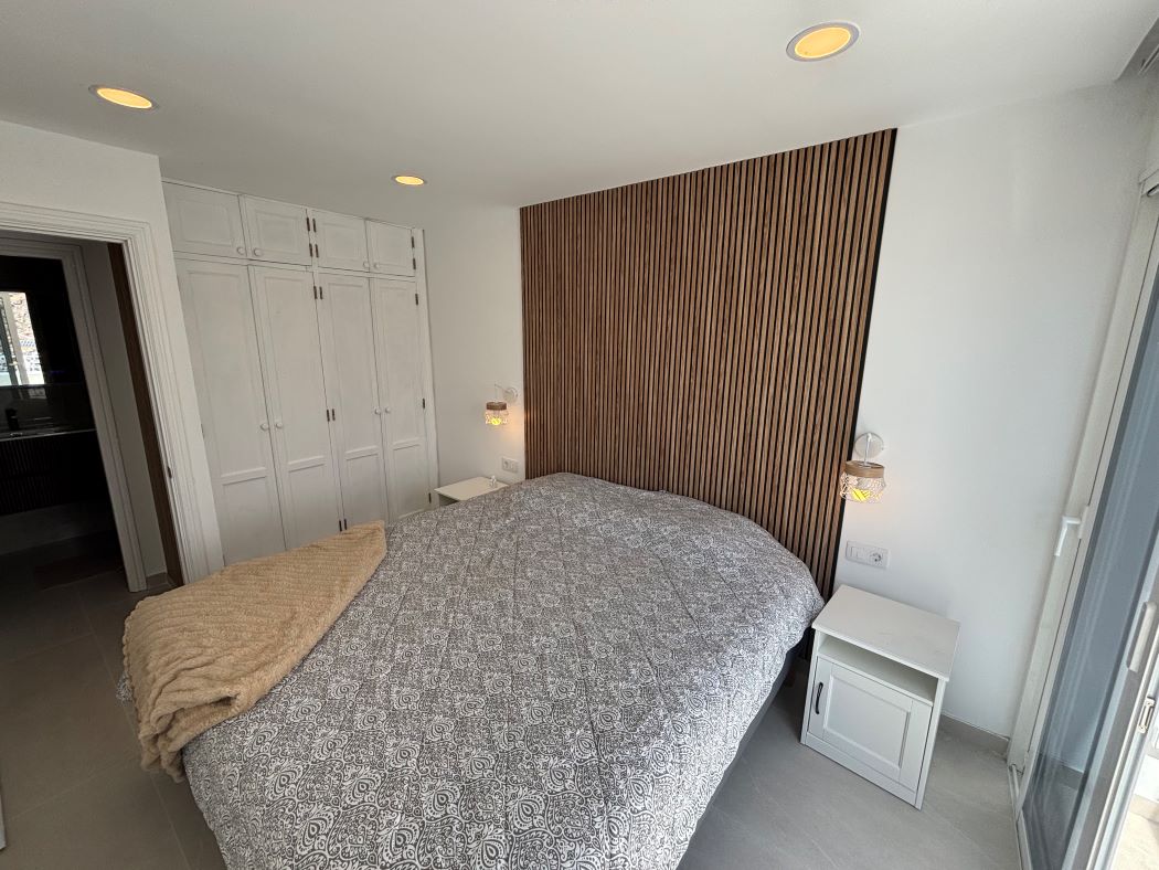 The bedroom with wardrobes seen from the doorway